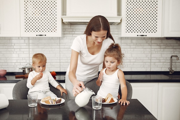 Beautiful family spend time in a kitchen