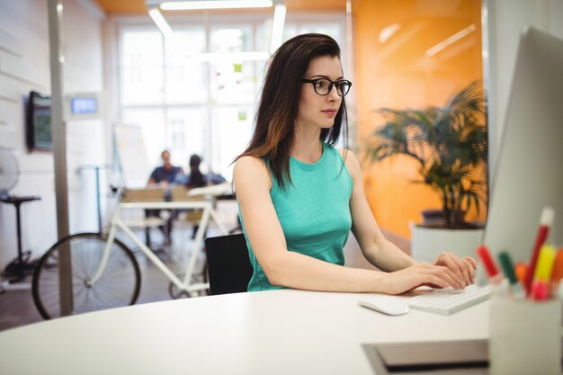 Beautiful female executive working at her desk