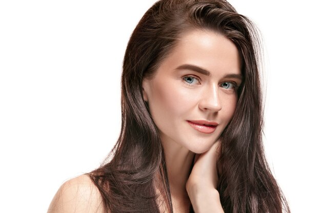 A beautiful female face. Perfect and clean skin of young caucasian woman on white studio background.