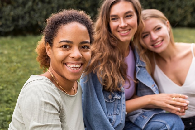 Free photo beautiful female friends taking a photo