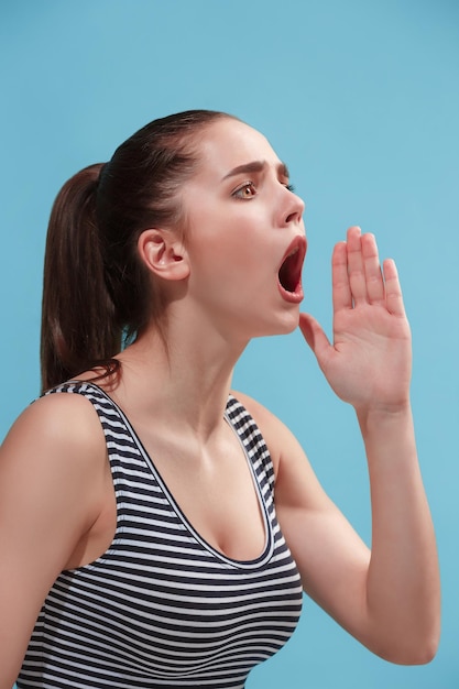 Free photo beautiful female screaming, calling someone