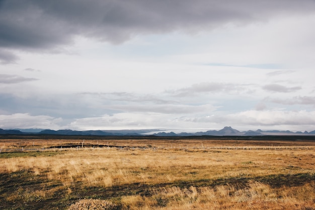 Beautiful field with high mountains and hills