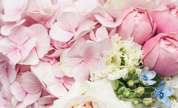 Beautiful flower bouquet arrangement close up in pastel colors. decoration of roses and decorative plants, selective focus Premium Photo