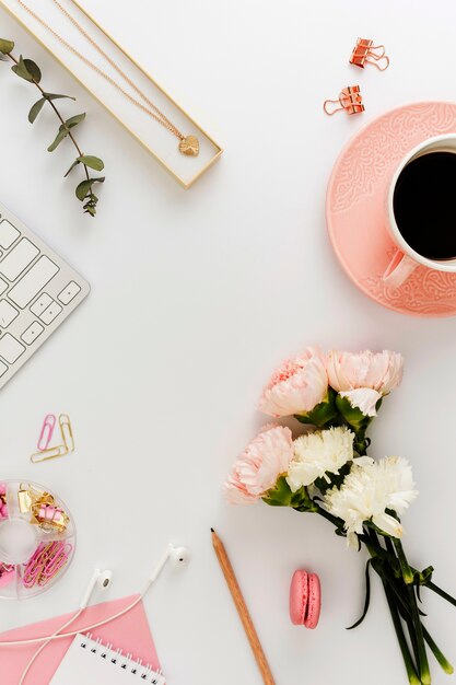 Beautiful flowers and coffee flat lay