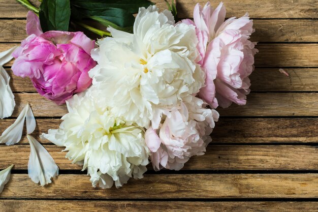 beautiful flowers on wooden background