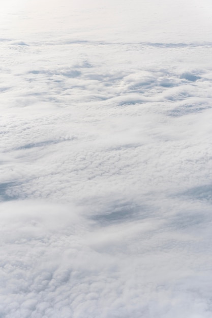 Beautiful fluffy clouds seen from airplane