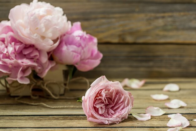 beautiful fresh flowers on wooden background, various flowers, place for text, closeup