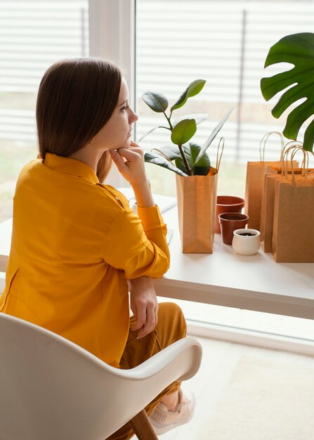 Beautiful gardener sitting on a chair