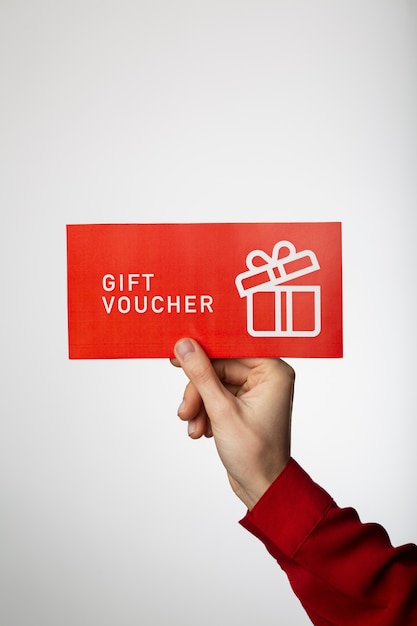 Free photo beautiful gift voucher with hand