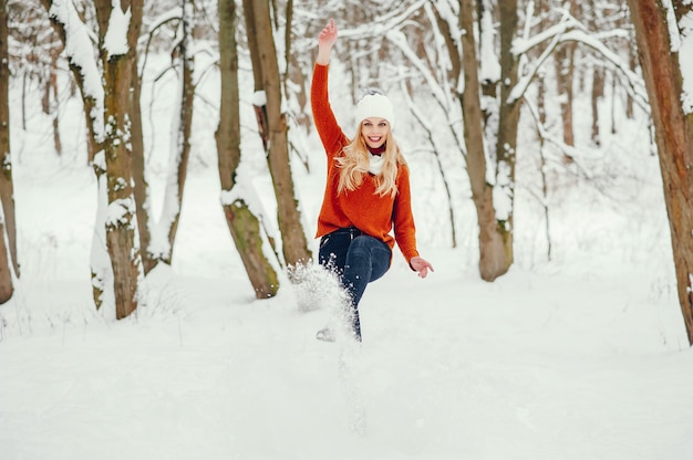 Beautiful girl in a cute orange sweater