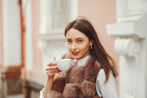 Beautiful girl drinks coffee 