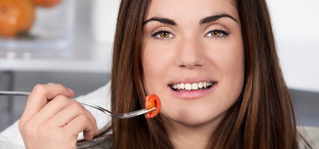 Beautiful girl eating healthy food, panoramic view