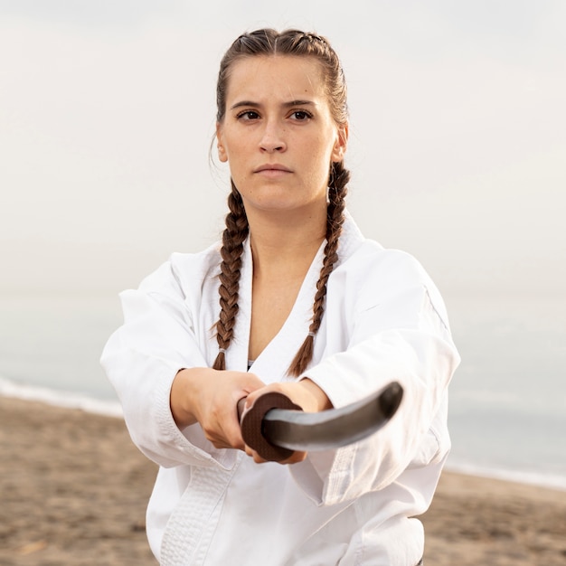 Beautiful girl exercising martial art