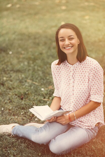 Beautiful girl holding an open book