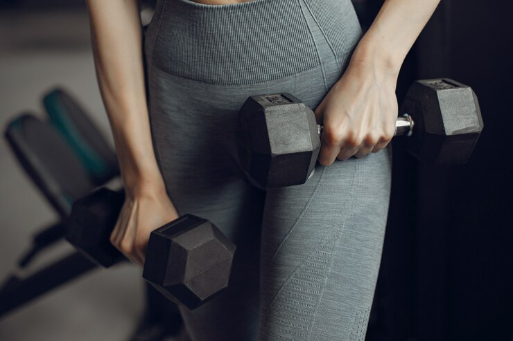 Free Photo a beautiful girl is engaged in a gym