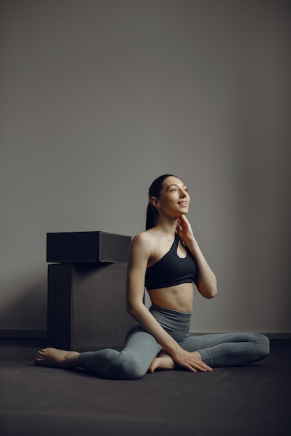 A beautiful girl is engaged in a gym