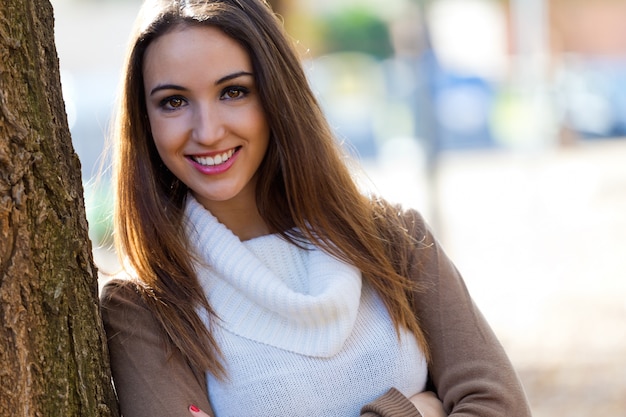 Beautiful girl looking at camera in autumn.