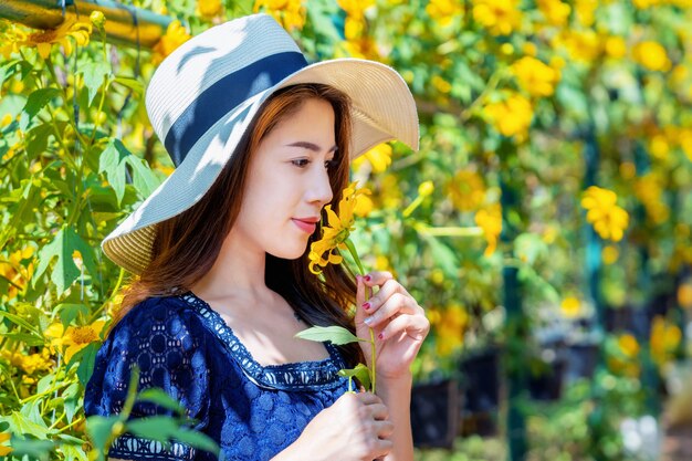 Beautiful girl and Mexican sunflower.