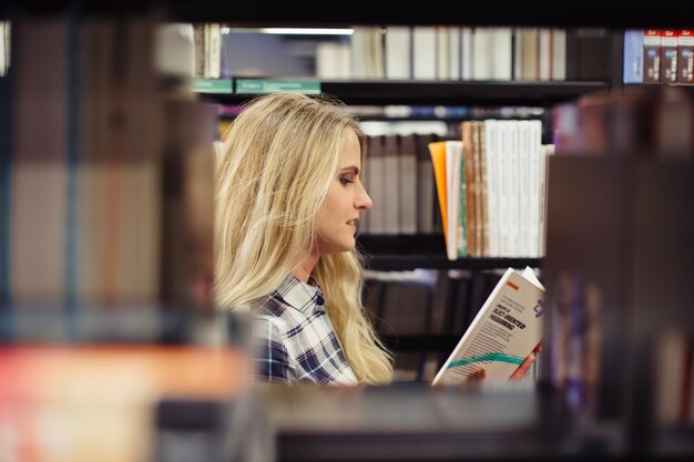 beautiful girl picking literature