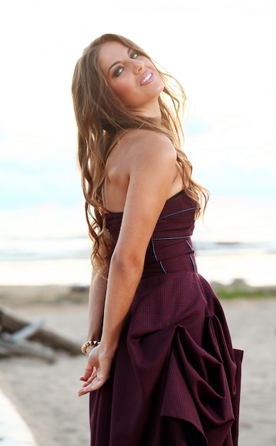 Beautiful girl posing near the sea