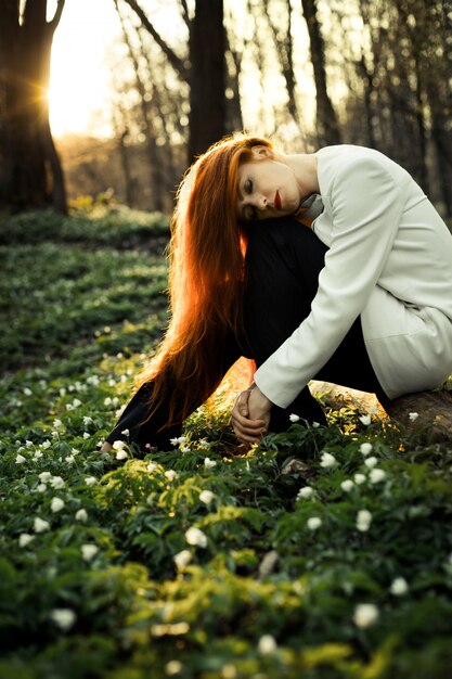 Beautiful girl posing for a photo in the sunset