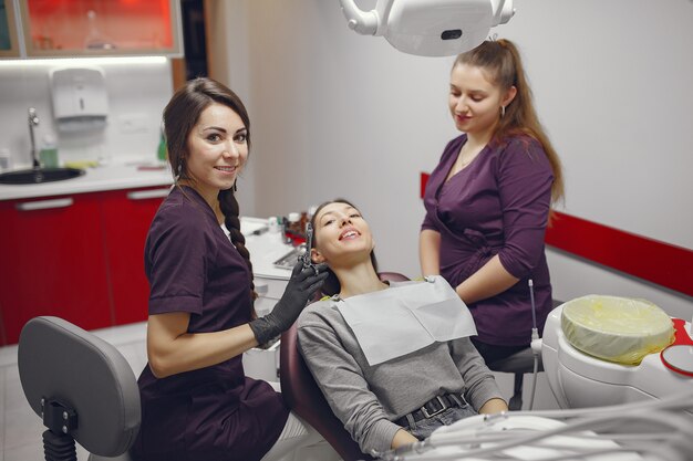 Beautiful girl sitting in the dentist's office