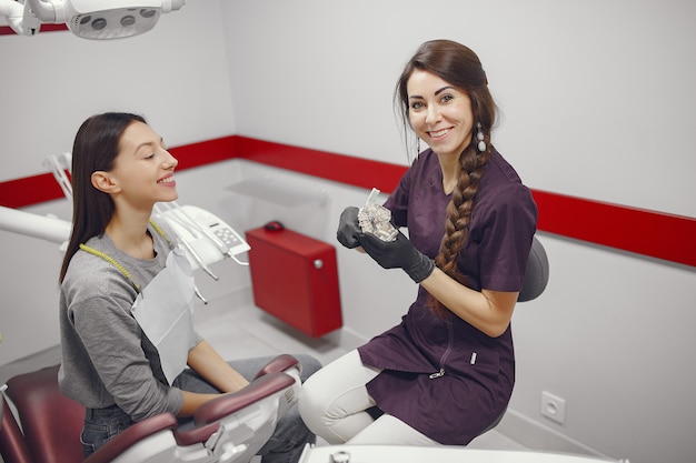 Beautiful girl sitting in the dentist's office