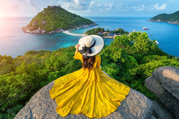 Beautiful girl sitting on viewpoint at Koh Nangyuan island near Koh Tao island, Surat Thani in Thailand