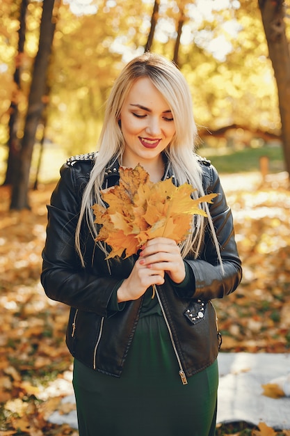 Beautiful girl standing in a summer park