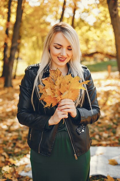 Beautiful girl standing in a summer park