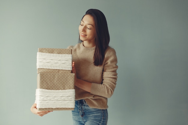 Free photo beautiful girl standing  with presents