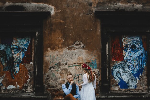 The beautiful girl stands near her boy