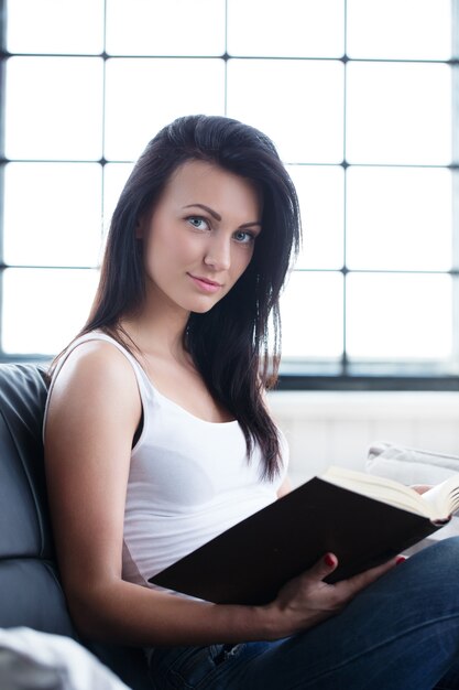 Beautiful girl studiying with a book