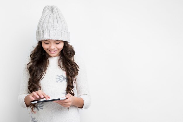 Beautiful girl touching the tablet screen