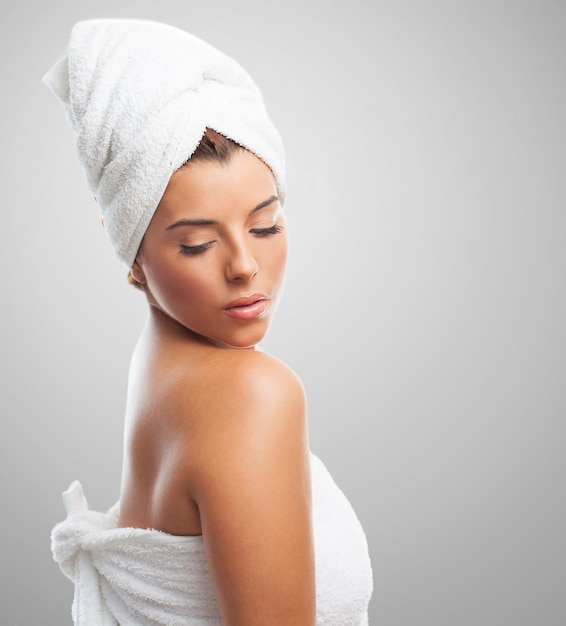 Beautiful girl in towel looking down