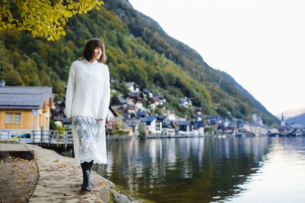 Beautiful girl walking around the autumn lake