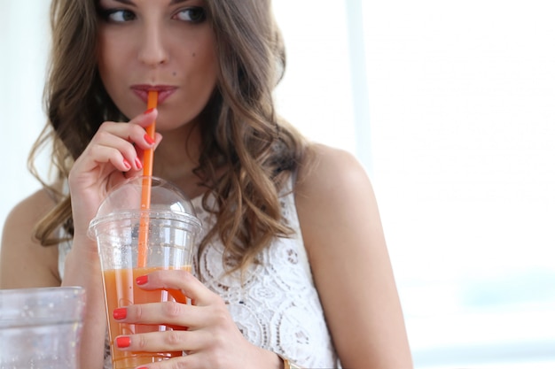 Free photo beautiful girl with orange juice