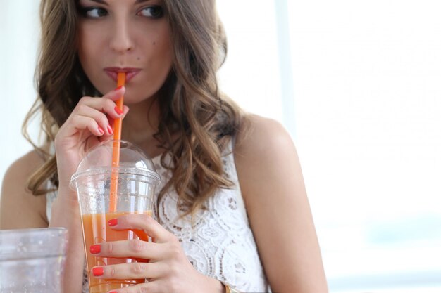 Beautiful girl with orange juice