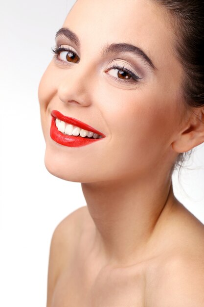 Beautiful girl with perfect skin and red lipstick