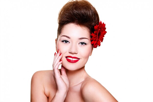 beautiful girl with red lips flower on her hair