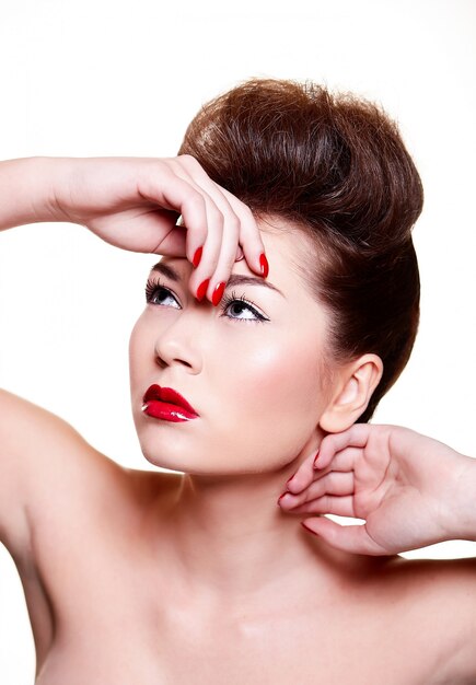 beautiful girl with red lips and nails