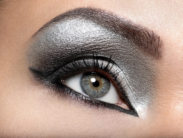 Free photo beautiful girl with the silver makeup of eyes.