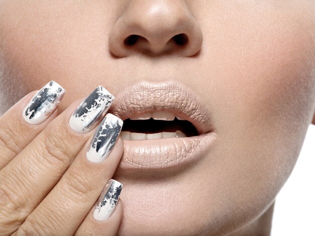 Beautiful girl with the silver metal nails.