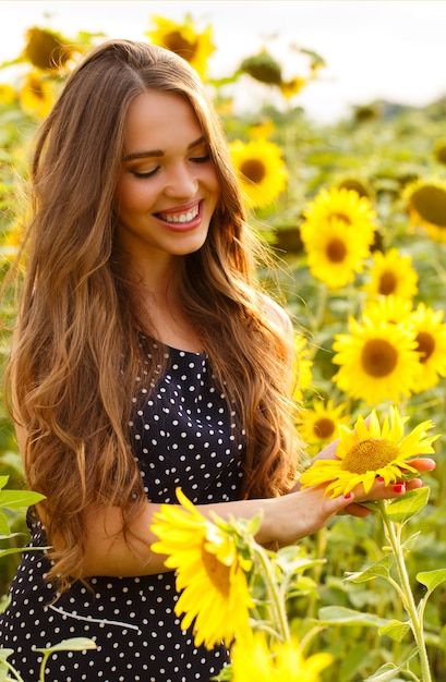 Beautiful girl with sunflowers