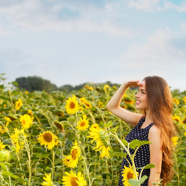 Beautiful girl with sunflowers