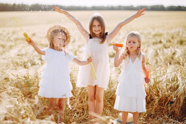 Beautiful girls have fun in an autumn field