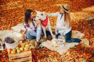 Free photo beautiful girls have fun in a autumn park