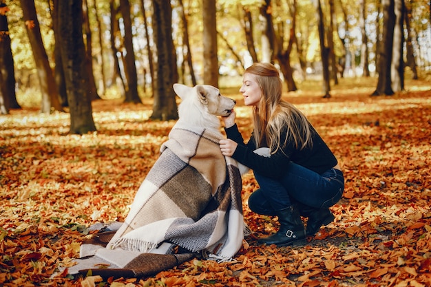 Beautiful girls have fun in a autumn park