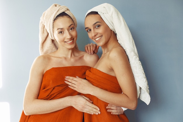 Beautiful girls standing  with towel