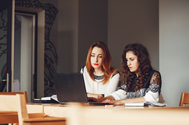 Beautiful girls work in the office